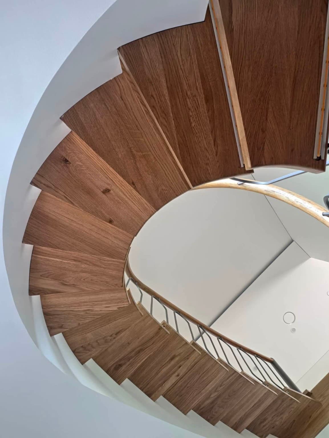 Curved staircase — wood & metal