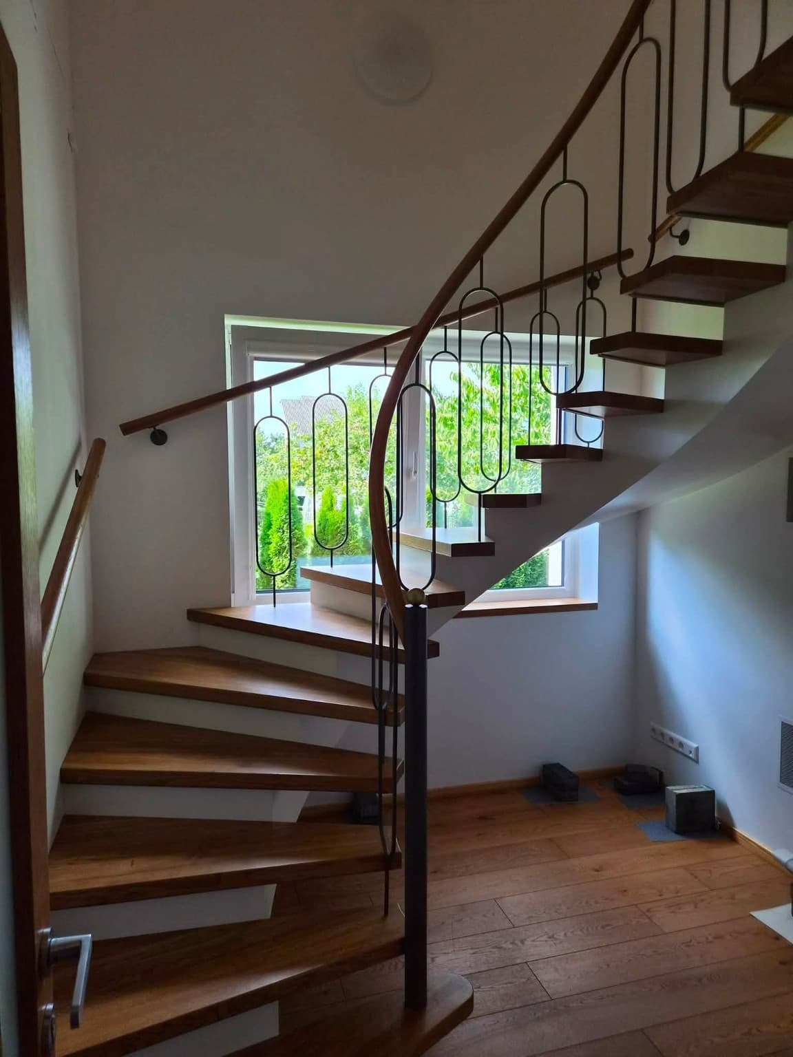 Curved staircase — wood & metal