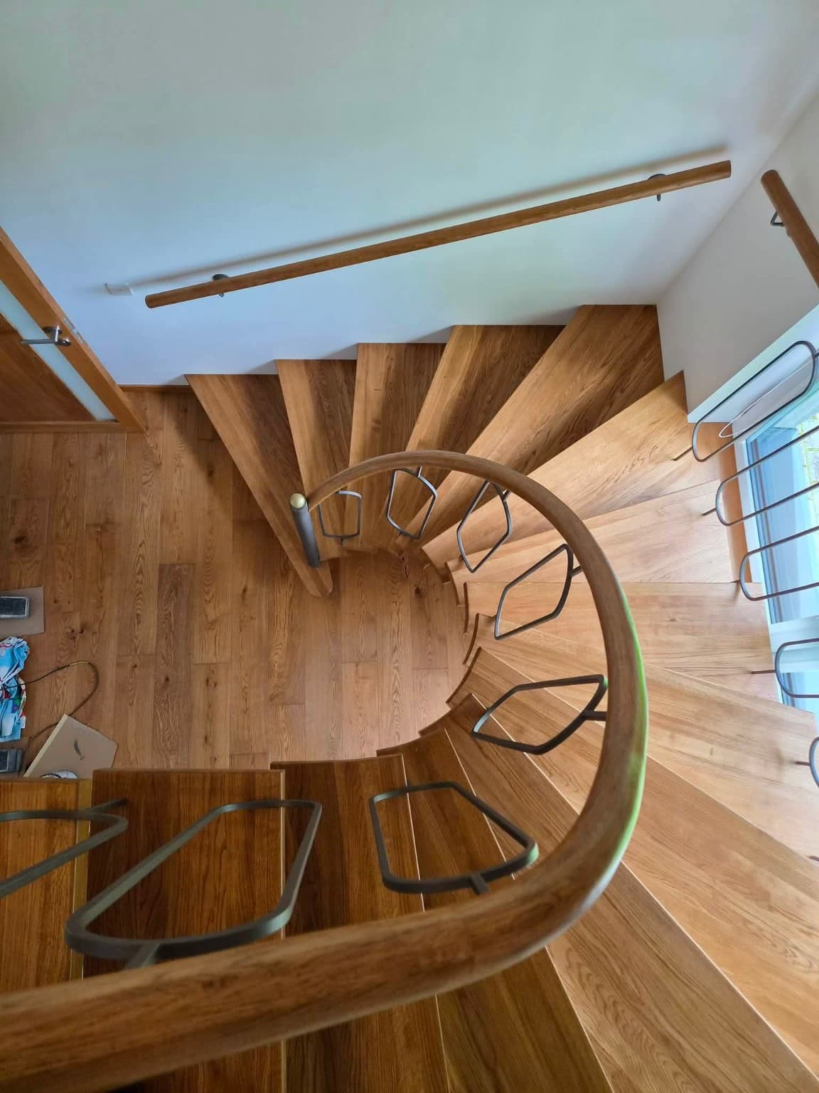 Curved staircase — wood & metal