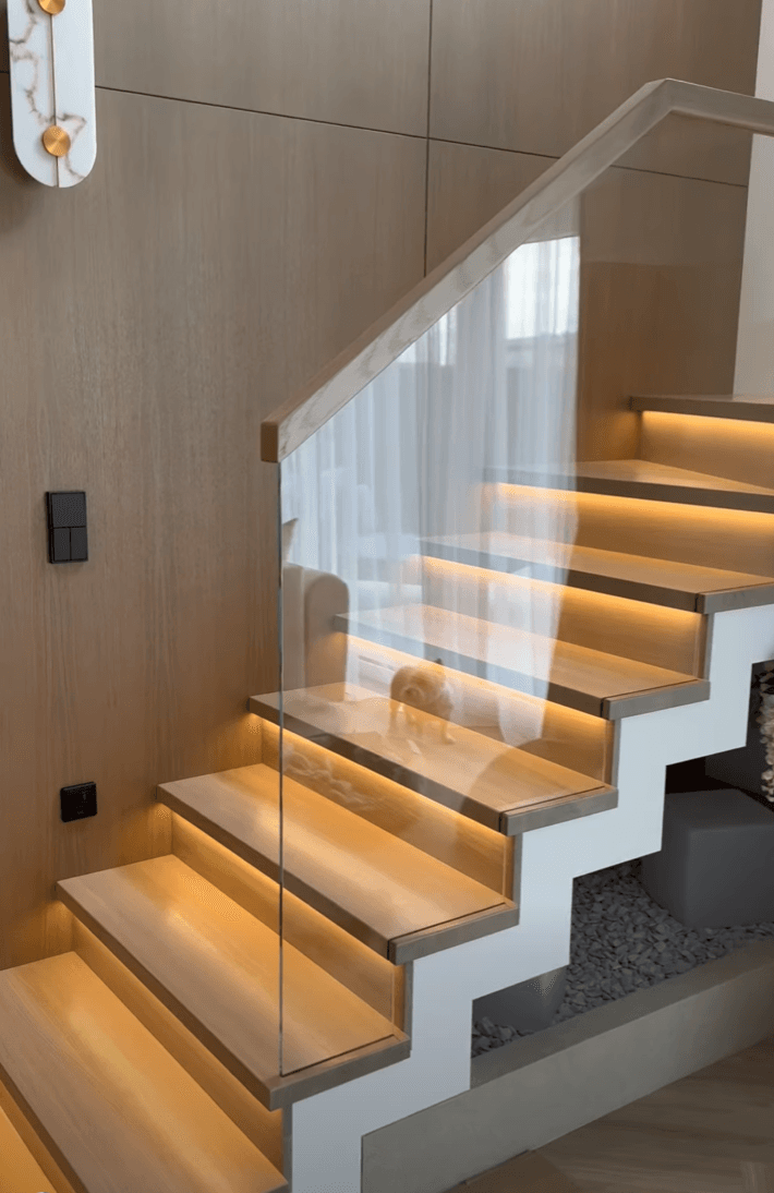 Concrete-clad staircase — wood, glass & LED